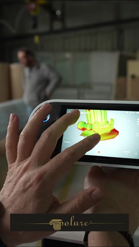 Hand touching tablet screen showing a 3D scanned column model