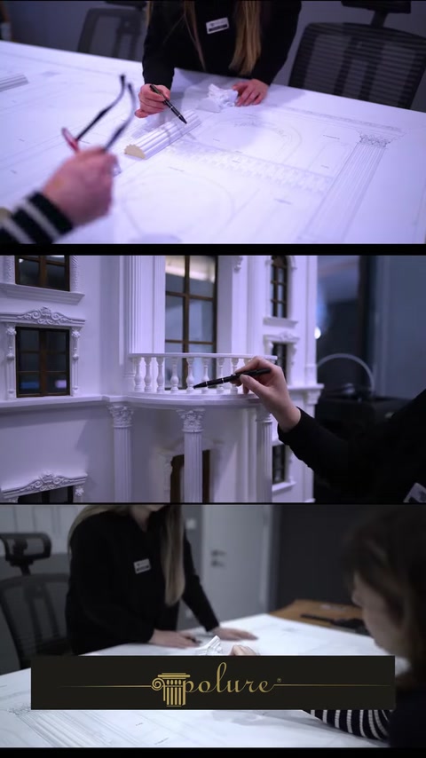 Hand pointing at balcony railing detail on a facade drawing
