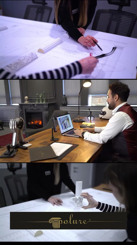 Architect working at desk with decorative fireplace visible nearby