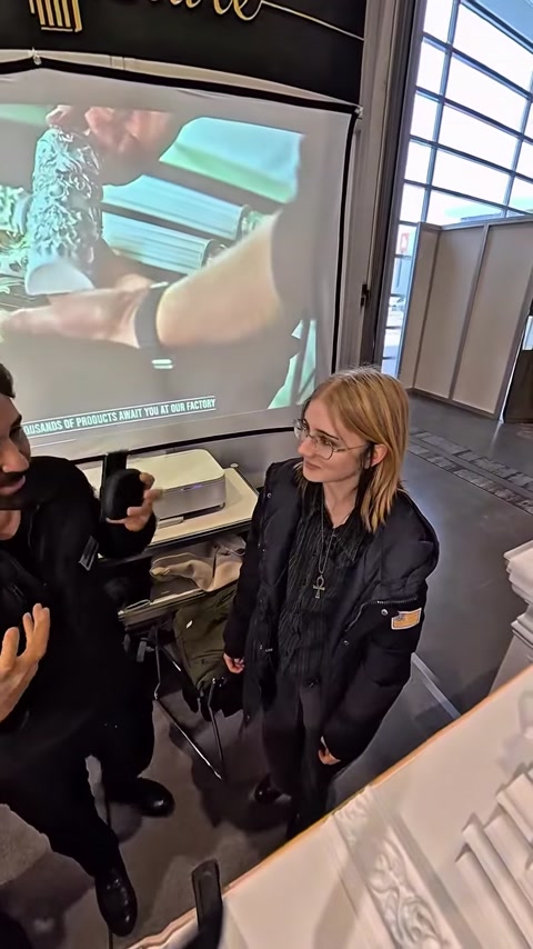 Close-up of hand adjusting VR controller during architectural walkthrough demo