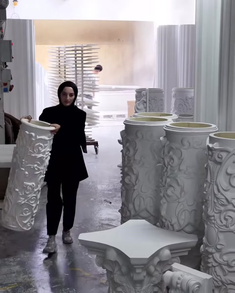 Embossed column shafts in different diameters are lined up in the work area.