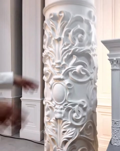 A classical column ornament and the details of a fluted shaft stand out.