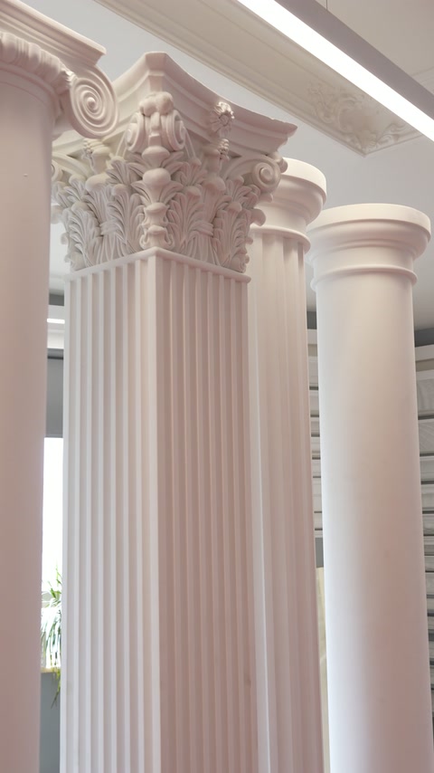Ornate Corinthian capital paired with a vertically fluted round shaft