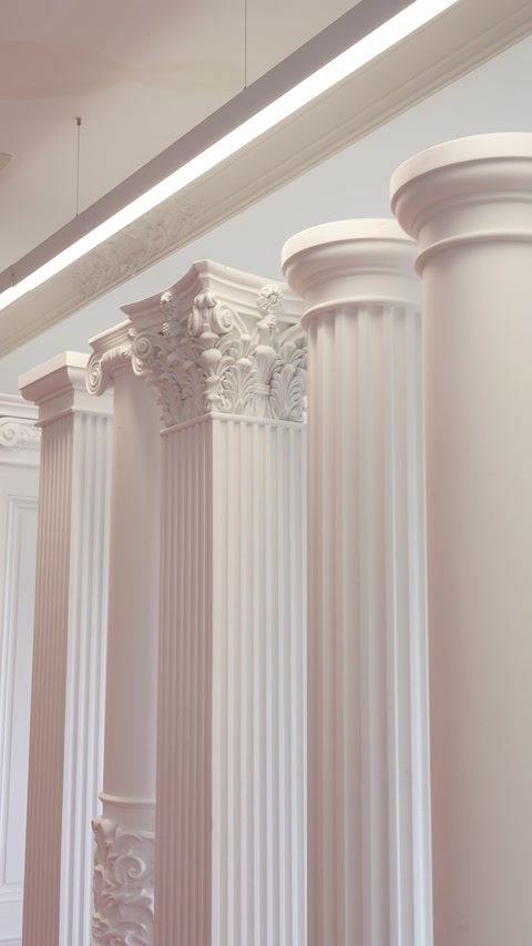 Smooth and fluted column models presented with contrasting capital styles