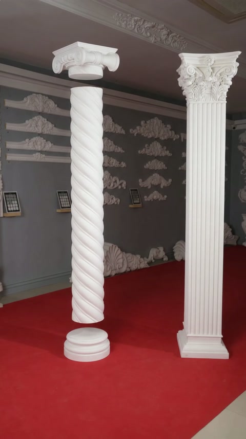 Twisted and fluted decorative columns displayed together in the showroom