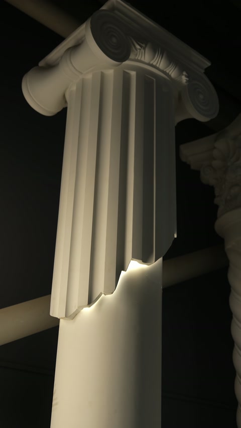 Ionic-style capital and fluted shaft shown with integrated accent lighting