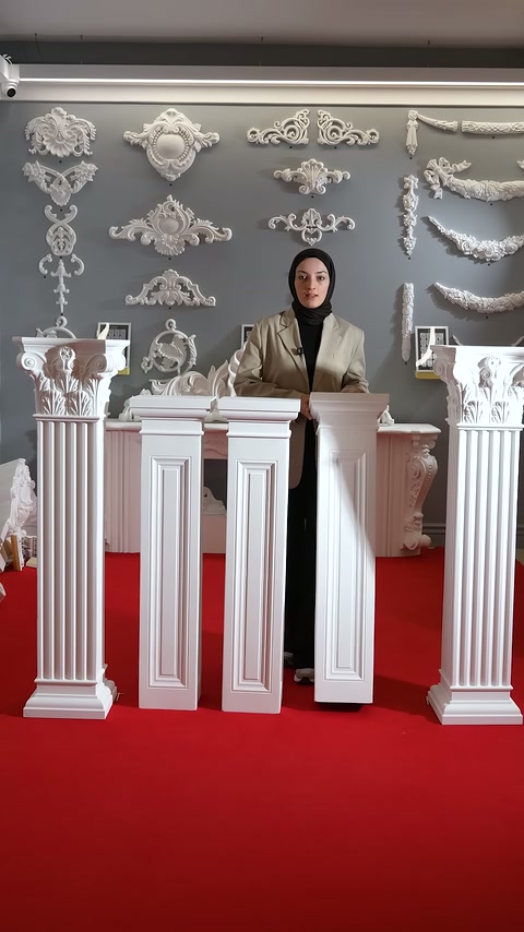 Presenter stands behind short columns featuring different body designs.