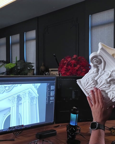 Designer rotates column capital piece to show acanthus leaf carving