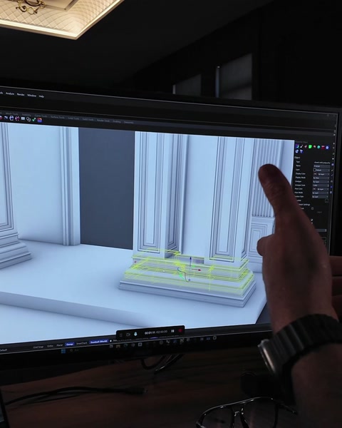 Designer points at portal model explaining column and arch layout