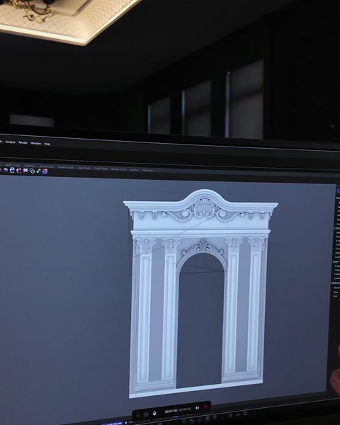 Monitor displays finished white 3D portal model from front angle