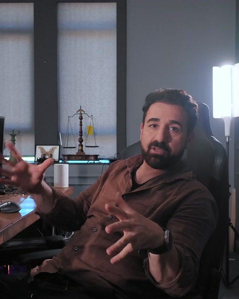 Presenter gestures while describing the AI-generated garden walkthrough scene