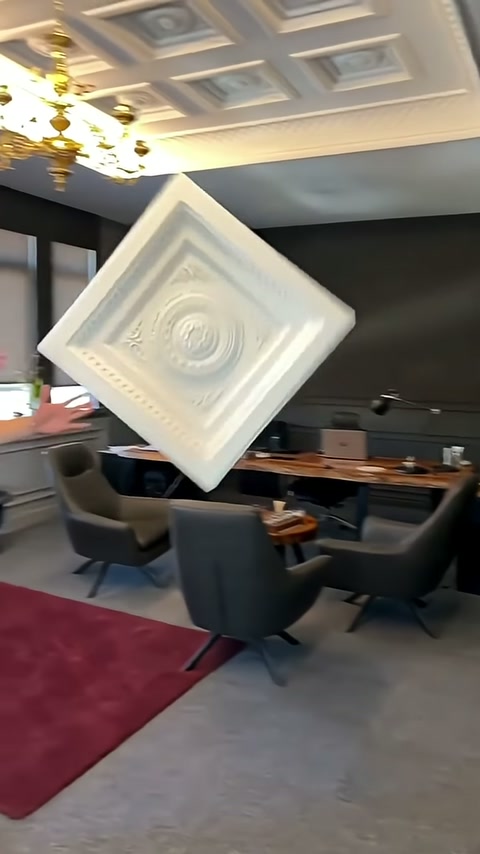 Square polyurethane panel presented at an angle in a room with pendant lighting.
