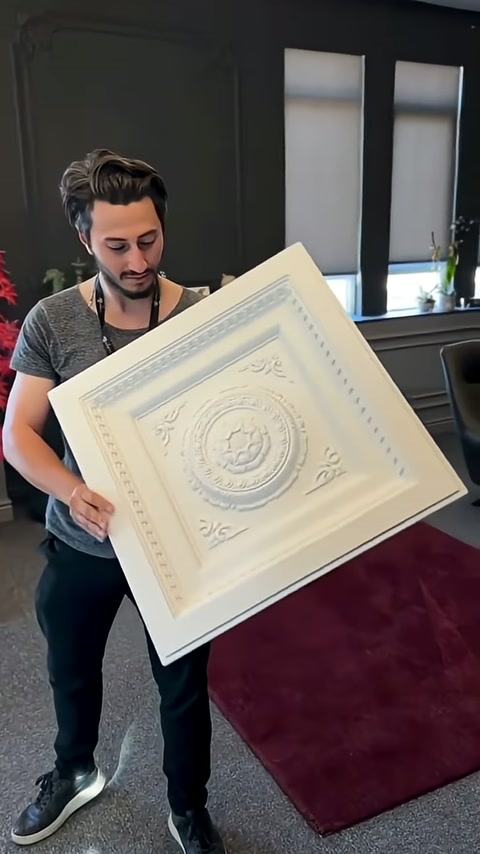 Corner motifs and round rosette visible on angled cassette panel.