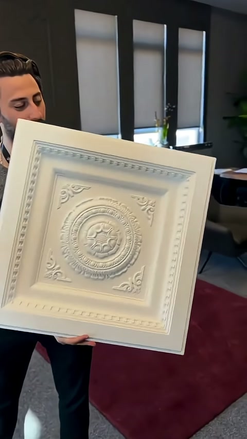 Interior border and corner ornaments stand out while panel fills frame.