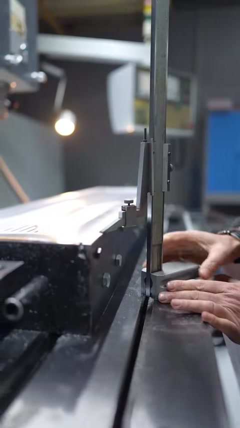 The machined mold surface is carefully inspected with measuring equipment