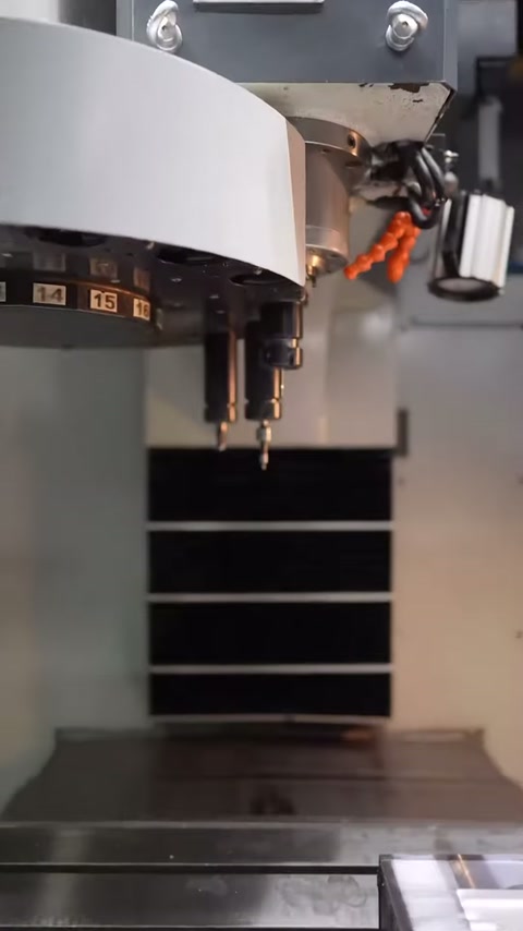 Vertical processing center spindle waits on the production table