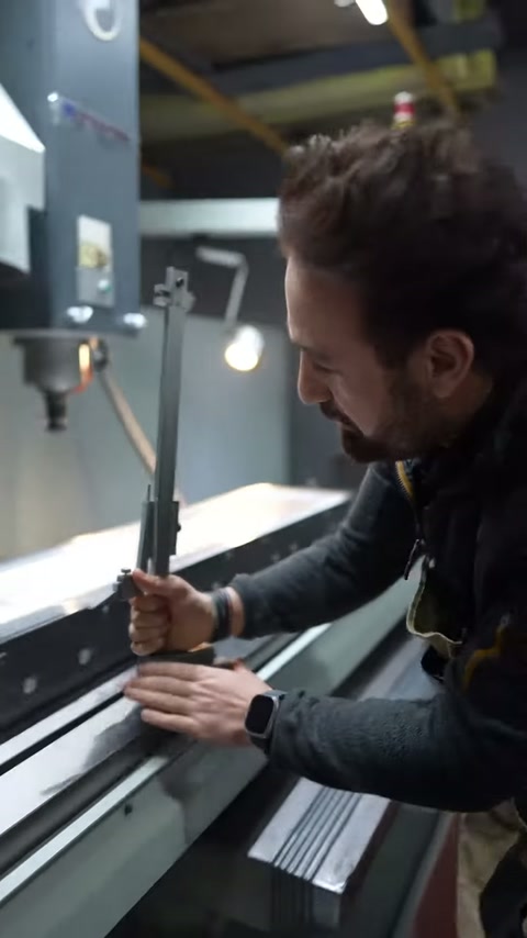 Operator uses the dial measurement device on the grooved piece