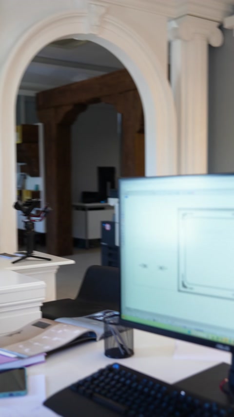 An interior design is reviewed on a computer screen in the showroom