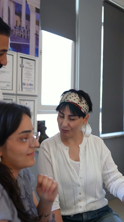 The showroom team evaluates interior design at a table.