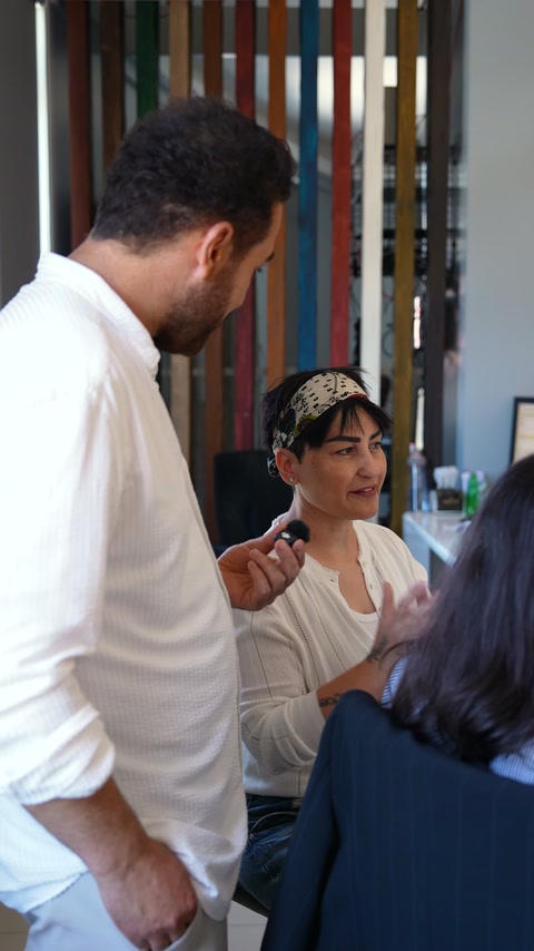 Selda discusses the design process with a microphone.