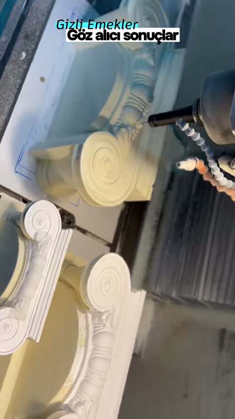 Two decorative column capitals in different shapes located in the processing area