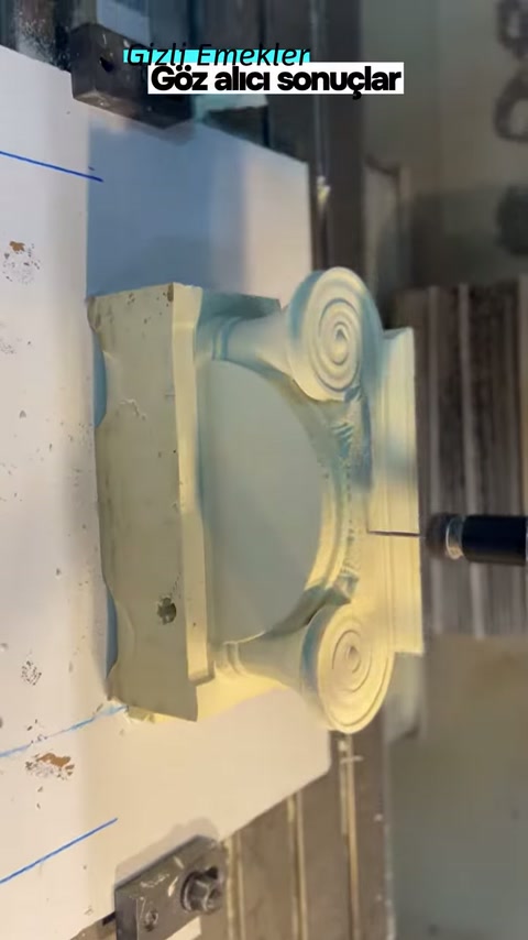Two spiral volutes of the decorative piece become distinct on the bench