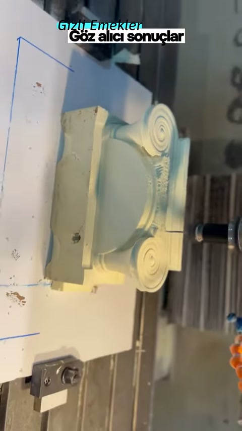 Wide curve in the center of the capital appears shaped on the machine table