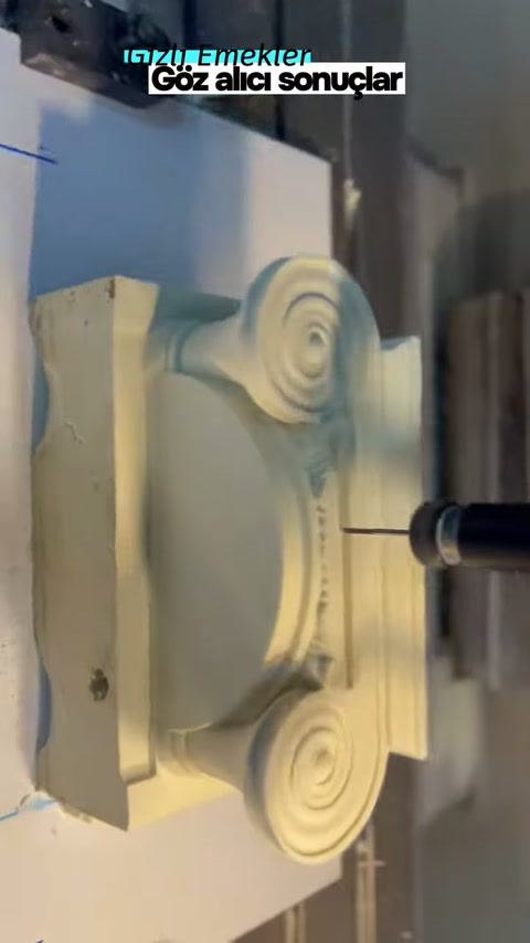 Cutting tip works next to the spiral ornamentation on the right side