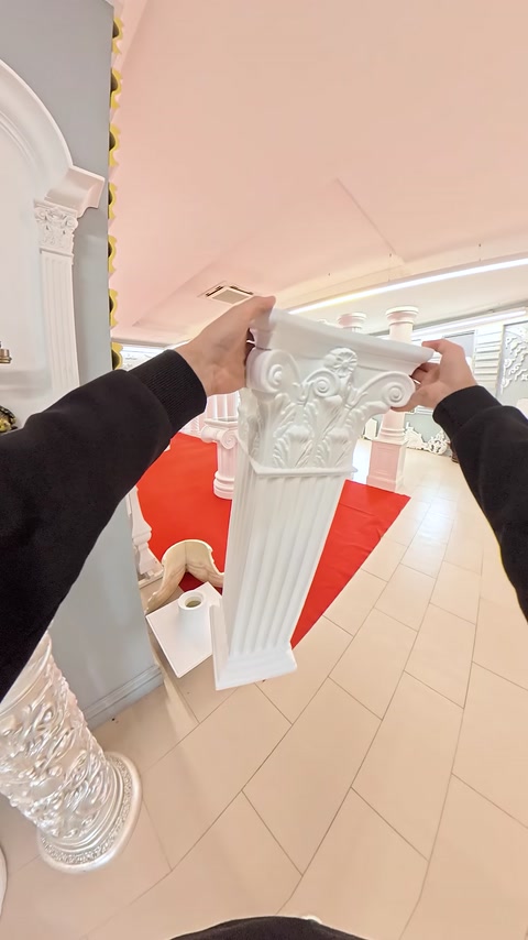 Detail of a Corinthian-style column capital decorated with leaf reliefs