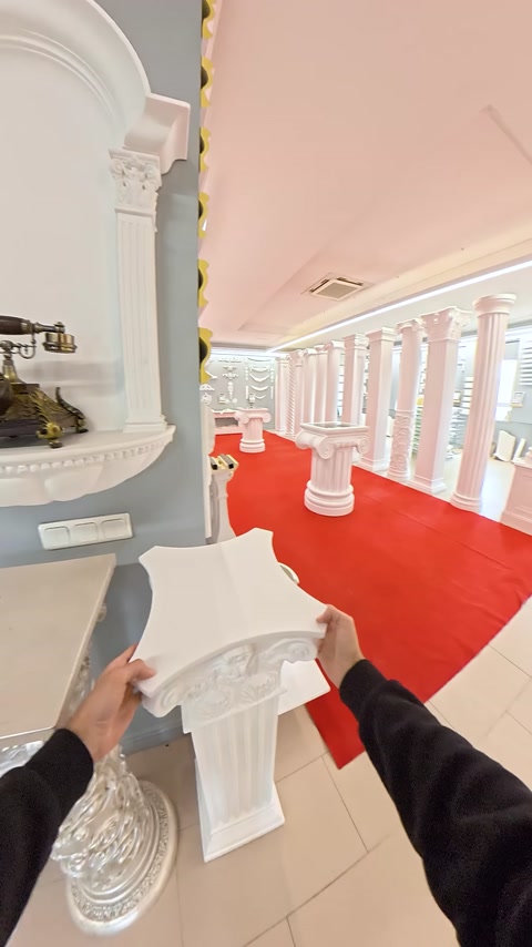 Decorative column capital shown together with showroom columns