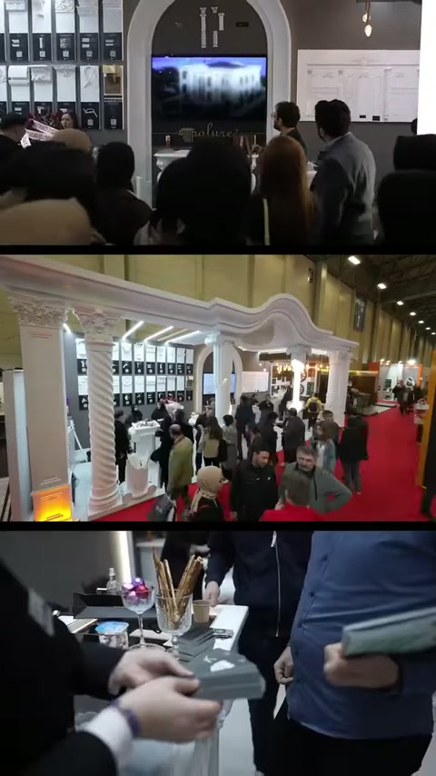 I visitatori ispezionano da vicino i campioni di prodotto mentre circolano nello stand con colonne