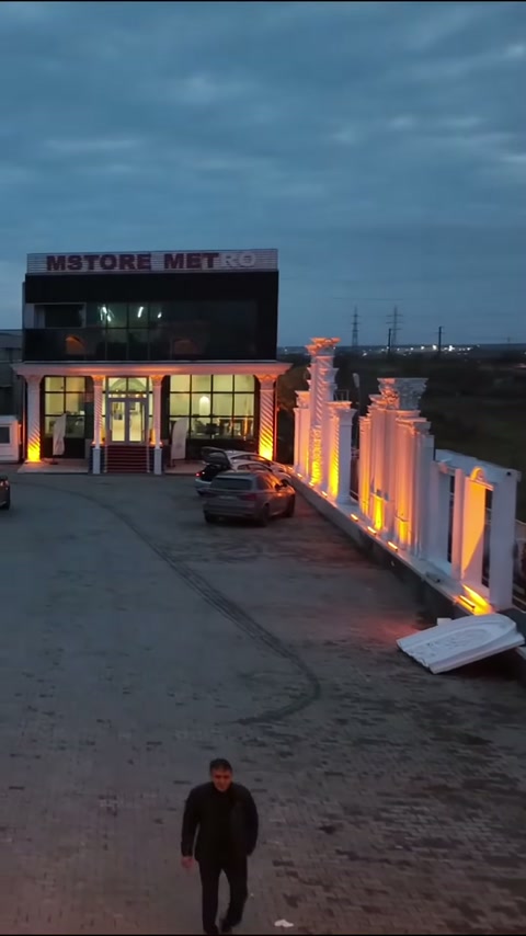 Illuminated surround columns defining the path to the business entrance