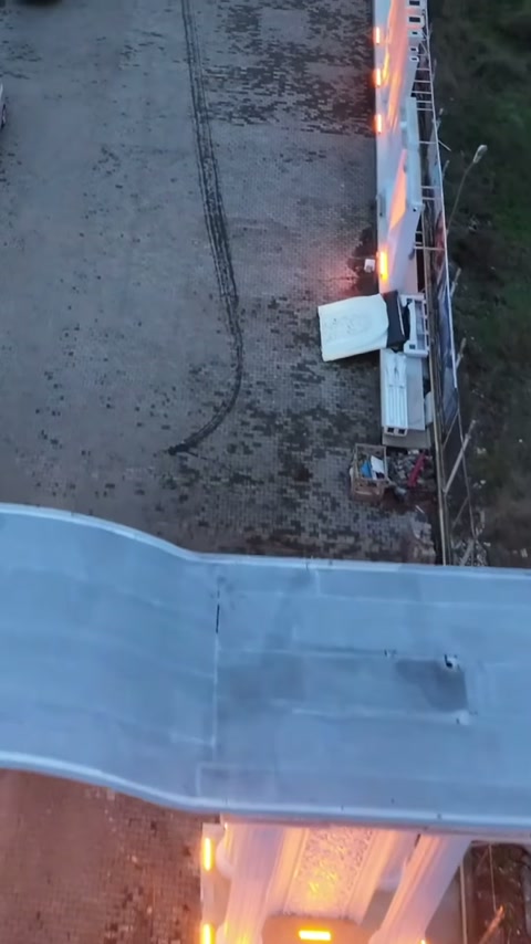 Arch cladding surface observed from above angle with illuminated column cluster