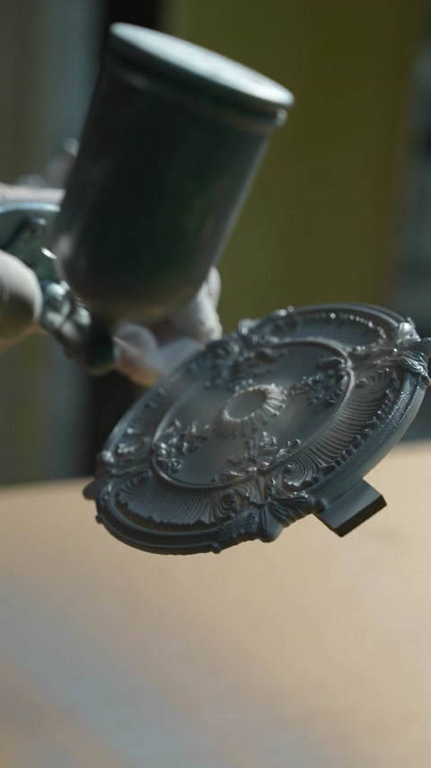 A close-up production process of a patterned decorative piece is shown