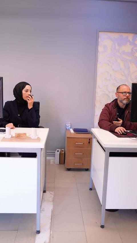 The office team communicates by radio during trade fair preparations