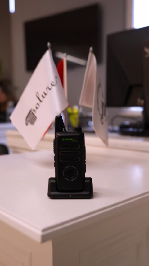 A radio used for trade fair preparations is placed on the worktable