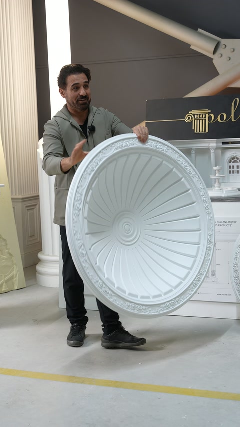 Circular radial dome features fluted sections around a central rosette