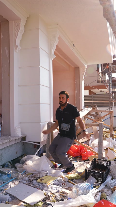Entrance columns and arch components take shape during on-site installation.