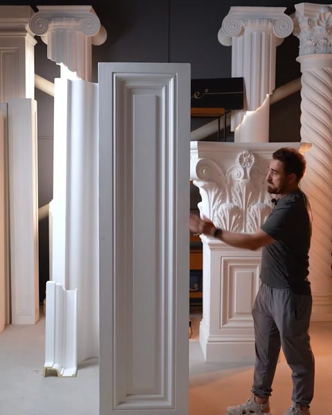 Tall carved door architrave panel standing upright showing border detail