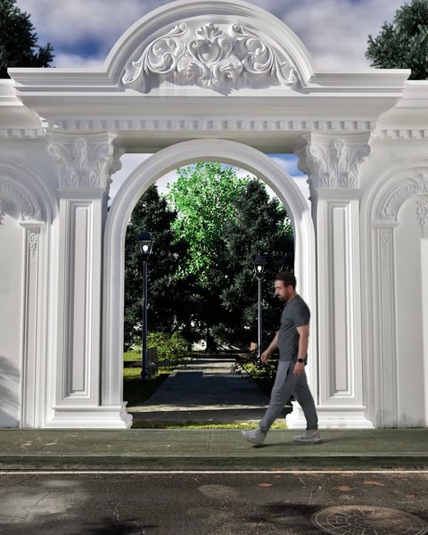 Finished entrance portal with crown, columns and pilasters framing garden view