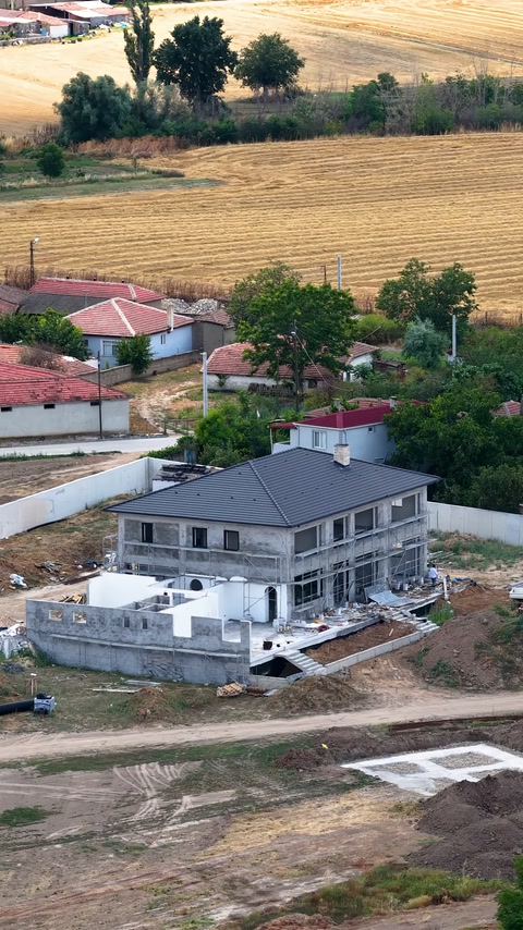 The exterior view of the villa under construction where the survey was carried out is visible