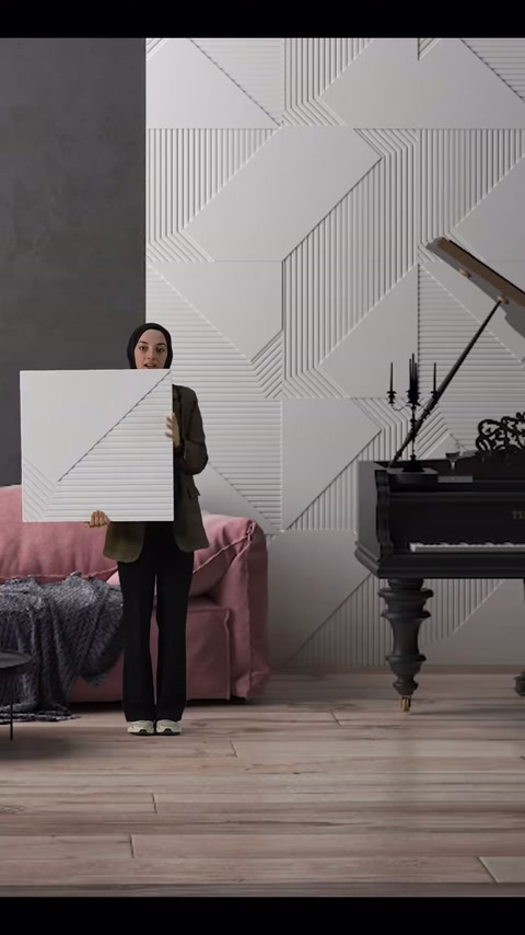 Il presentatore mostra il pannello quadrato con motivo diagonale all'altezza del busto