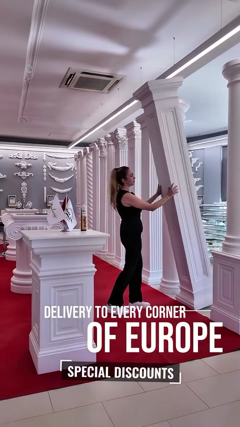 Woman touching a fluted polyurethane pillar in showroom display