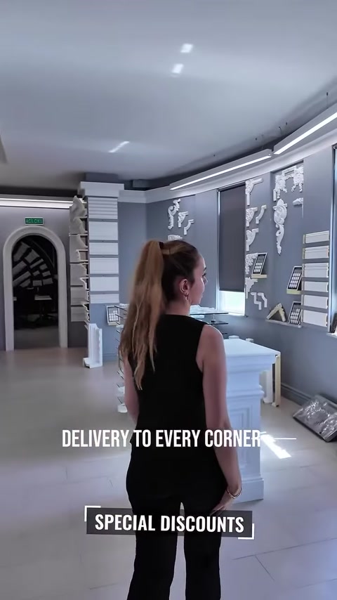 Archway leads to a hall of column and pillar models
