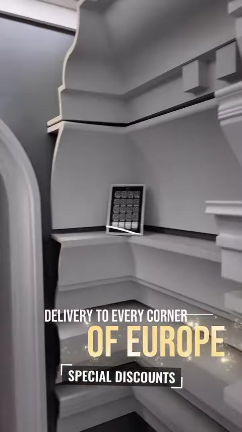 Cornice corner sample displayed near an archway entrance