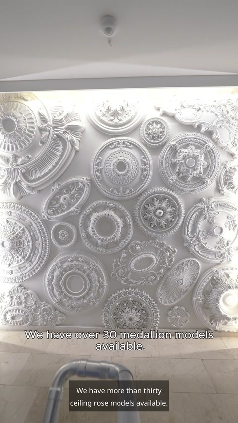Overhead display of assorted white polyurethane medallions in various sizes