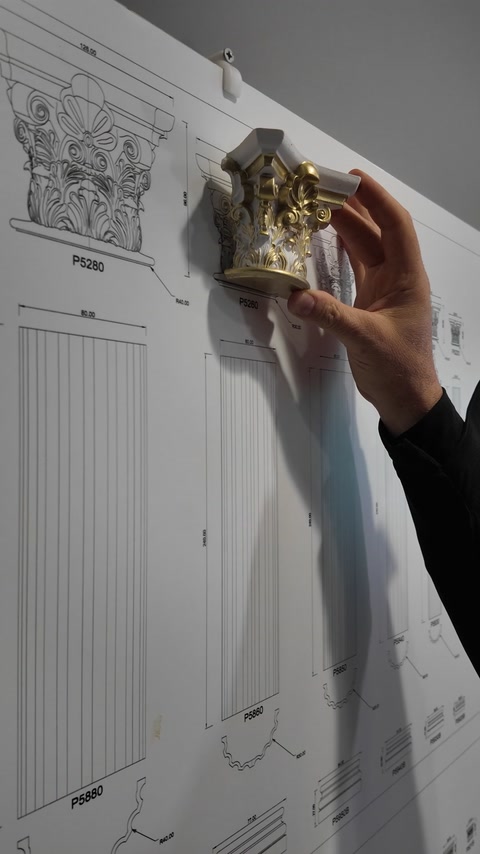 Detailed capital miniature aligns with its corresponding decorative column design
