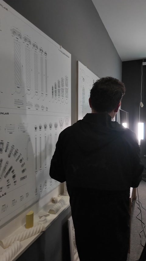 Wall-mounted product charts organize numerous interior decorative profile options