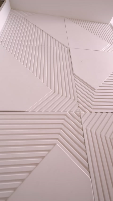 Close detail of lined triangular patterns on joined panel surfaces visible