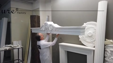 The craftsman places a horizontal profile piece on a sample facade arrangement